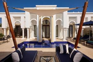 a view of a villa with a swimming pool at Banyan Tree Tamouda Bay in Fnidek