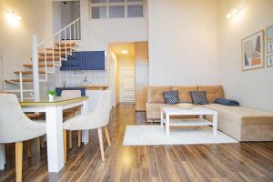 a living room with a couch and a table at Apartments Micic in Zlatibor