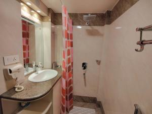 a bathroom with a sink and a shower at Sherpa Home Hotel in Kathmandu