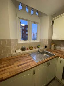 a kitchen with a sink and a window at Gated Stunning Period Studio in Vibrant Bristol in Bristol