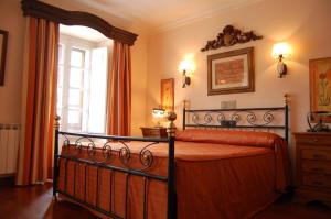 Un pat sau paturi într-o cameră la Posada Casa de don Guzman