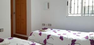 a bedroom with a bed and a window at Family Apartment in La Herrada near the Lake in Los Montesinos