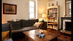a living room with a couch and a coffee table at La Vicomtesse de Seillans in Seillans +21 photos