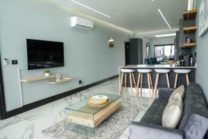 a living room with a couch and a table at 253 on Ipahla in Amanzimtoti