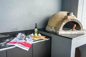 a kitchen with a pizza oven on a counter at 253 on Ipahla in Amanzimtoti