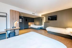 Postel nebo postele na pokoji v ubytování B&B HOTEL Dijon Valmy Toison d'or