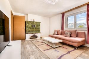 A seating area at Familienferienwohnung Buerserberg Dorf by A-Appartments