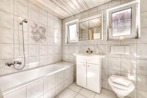 A bathroom at Familienferienwohnung Buerserberg Dorf by A-Appartments
