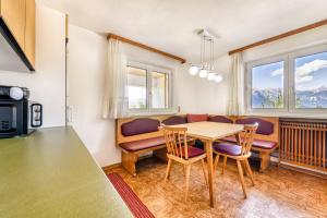 A seating area at Familienferienwohnung Buerserberg Dorf by A-Appartments