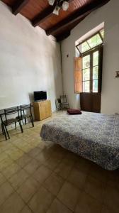 En eller flere senge i et værelse på Monoambiente centro