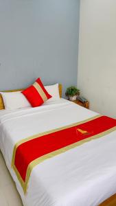 Postel nebo postele na pokoji v ubytování Hotel Bảo Quang