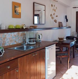 a kitchen with a sink and a counter at Kortiri Studios in Agios Nikolaos