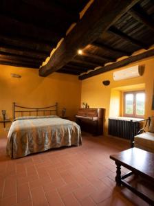 Postel nebo postele na pokoji v ubytování La Rimbecca Greve in Chianti