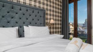Posteľ alebo postele v izbe v ubytovaní Brettania Hotel