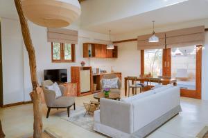 a living room with a couch and a table at O2 Villas Yala in Yala