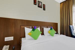 Voodi või voodid majutusasutuse Hotel Crosswinds West toas