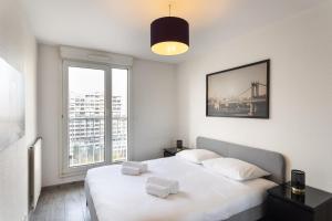 Posteľ alebo postele v izbe v ubytovaní Le Lounge - 2 chambres avec parking