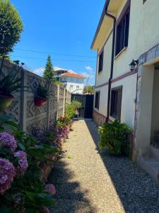 a walkway in front of a house with flowers at Cozy Flat with Backyard and Fireplace in Sapanca in Sapanca