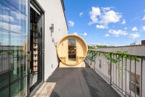 a building with a wooden circle on a balcony at Brooklyn love loft - Private hidden gem in Brooklyn in Brooklyn