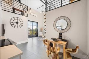 a kitchen with a table and a mirror on the wall at Brooklyn love loft - Private hidden gem in Brooklyn in Brooklyn