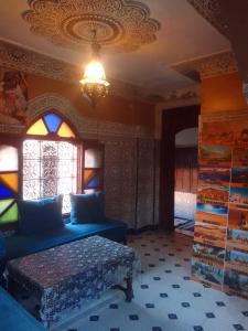 a room with a bed and a window at Riad Dar Zaida in Marrakech