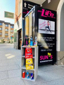 a stand for a sun sign in front of a store at Jainzen Einzimmerferienwohnung mitten im Zentrum in Bad Ischl