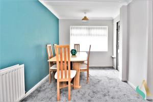 a dining room with a table and chairs at Newbury Lodge TSAC in Billingham