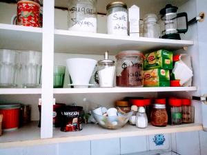 a kitchen pantry filled with lots of food items at De Nachtegaal in Eláfion