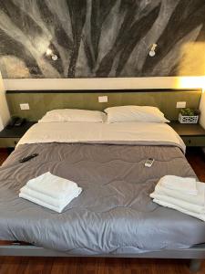 Krevet ili kreveti u jedinici u okviru objekta Hotel Como