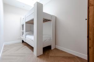 Postel nebo postele na pokoji v ubytování Dunefront Apartment