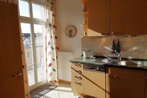 a kitchen with a sink and a counter top at Bellevue-App-05 in Ahlbeck