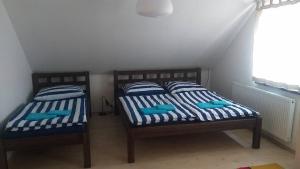 Postel nebo postele na pokoji v ubytování Chalupa U Bednáře