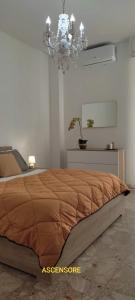 Ένα ή περισσότερα κρεβάτια σε δωμάτιο στο APPARTAMENTO DELIZIOSO CON TERRAZZO IN CENTRO-DELICIOUS APARTMENT WITH TERRACE