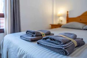 A bed or beds in a room at 797 HR - Pueblo Evita- Andalusian apartment with terrace.