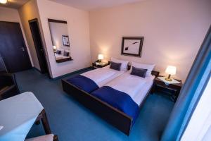 Postelja oz. postelje v sobi nastanitve Hotel & Restaurant Zum Riesen