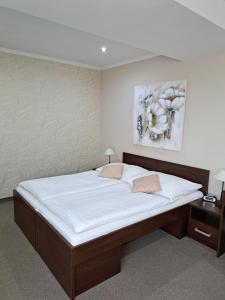 Postel nebo postele na pokoji v ubytování Hotel Galanta