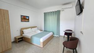 Postel nebo postele na pokoji v ubytování Sweet Hotel