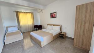 Postel nebo postele na pokoji v ubytování Sweet Hotel + 25 fotografií