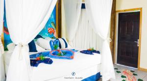 Postel nebo postele na pokoji v ubytování Fantasy Island Beach Resort and Marina - All Inclusive