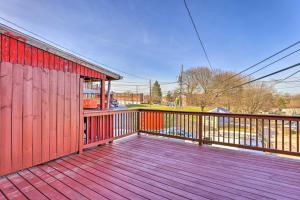 a wooden deck with a fence and a red building at The Gallery, an Allentown Retreat with Views! in Allentown