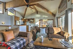 a living room with two couches and a table at Steps to Diamond Peak Incline Village Condo in Incline Village