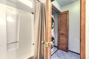 a door leading into a laundry room with a washing machine at Steps to Diamond Peak Incline Village Condo in Incline Village +17 photos