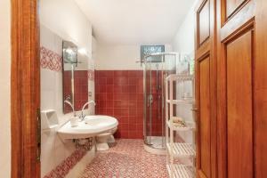a bathroom with a sink and a shower at Villa Toscana a Fiesole in Fiesole