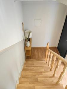 a staircase in a house with a fan and a lamp at Mimosa House in Gythio