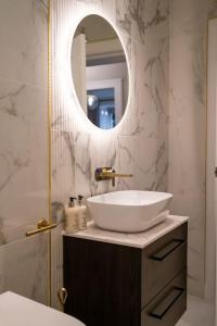 a bathroom with a sink and a mirror at The Wilton Suite - Your Private 5* Escape! in Glasgow +19 photos