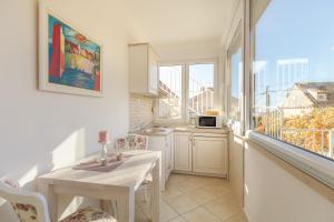 Kuchyň nebo kuchyňský kout v ubytování Apartments Regjo