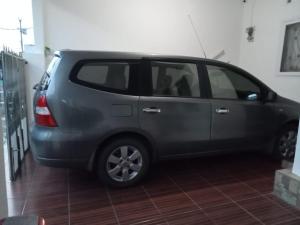 a small gray car parked in a room at D5 Homestay Syariah Sumampir Purwokerto in Purwokerto