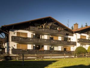 a building with balconies on the side of it at Almzeit in Farchant