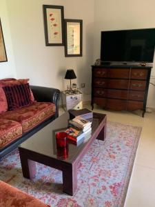 a living room with a couch and a coffee table at Camino del Faro LALBIR Alicante in Albir