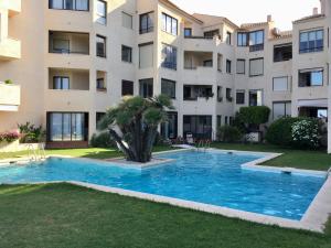 a swimming pool in front of a building at Camino del Faro LALBIR Alicante in Albir